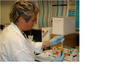 0333378_2009_miles_igert_trainee_annie_aigster_analyzing_blood_samples